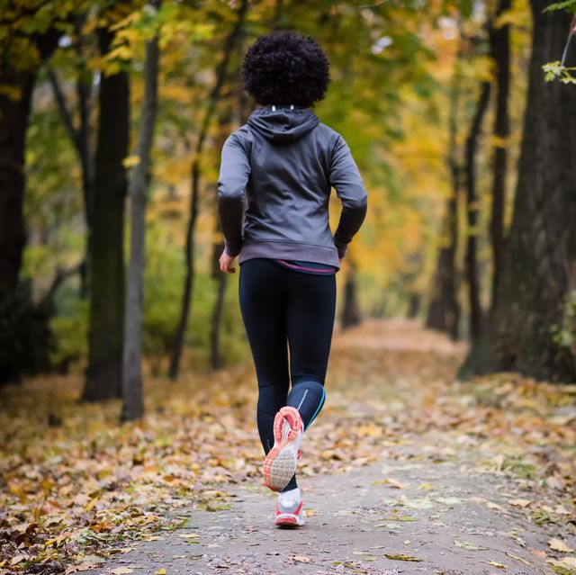 young-woman-jogging-through-the-fall-park-rear-shot-royalty-free-image-1632499281